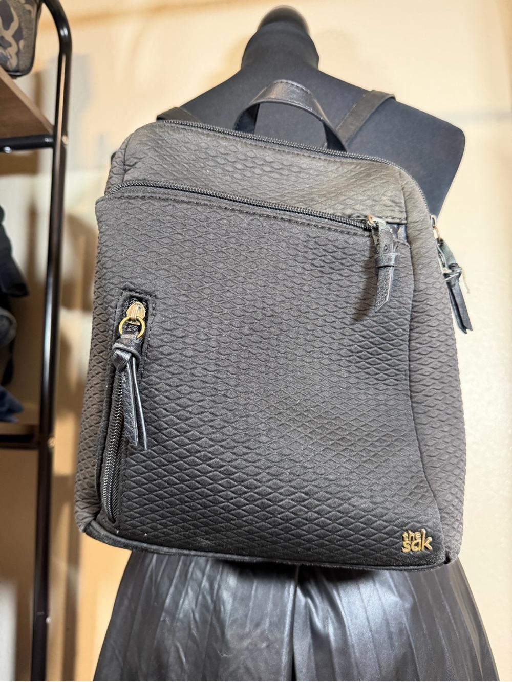 The Sak Quilted Mini Backpack in Black with Gold Hardware